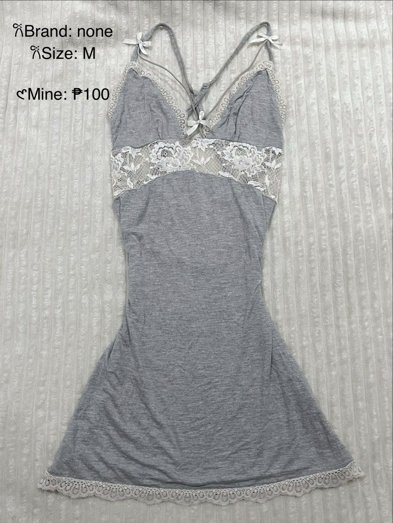 Grey Lace Slip Dress (Category: Dresses) located in Manila. Submitted by jael_thrift (Listing ID 1469447646, Image 1). Description: - Colour: Grey with white lace trim and straps - Details: Cute white bows on the front and shoulders - Size: Medium (M) - Fit: Fitted style, short length - Material: Soft and stretchy fabric - Condition: Great as nightwear or lounge piece - Price: 100 PHP only.