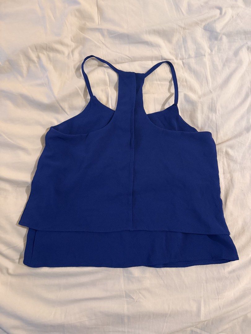 GTWFAB Blue Double Layer Tank Top Size M (Category: Sleeveless) located in Quezon City. Submitted by ianne.declutter (Listing ID 1469437378, Image 3). Description: M on label but more like S-M - Brand/Model: GTWFAB blue tank top - Size: Medium (M) - Design: Racerback straps and trendy layered hem - Material: Textured fabric throughout - Versatility: Great for warm weather or layering under jackets; easy to pair with shorts or jeans - Condition: C