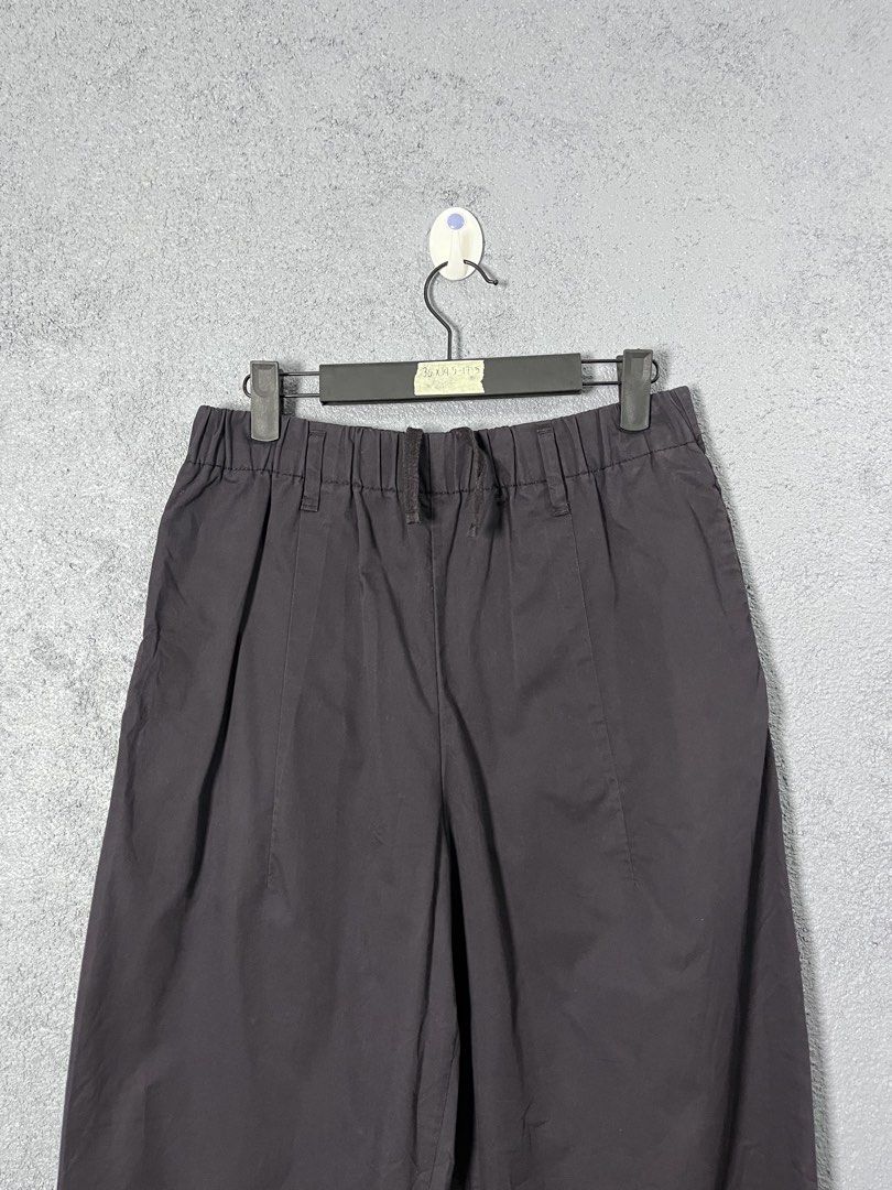 GU Black Drawstring Casual Pants Size S (Category: Joggers) located in Famy. Submitted by basicthrifted (Listing ID 1469405479, Image 2). Description: - Brand: GU - Color: Black - Size: S - Waist: Elastic waistband with built-in drawstring for easy adjustment - Fit: Straight-leg cut with stylish crease detailing down the front - Fabric: Lightweight and comfortable for daily wear - Measurements (from hanger tag): 36 x 14.5 - 17.5 - Condition: Clea