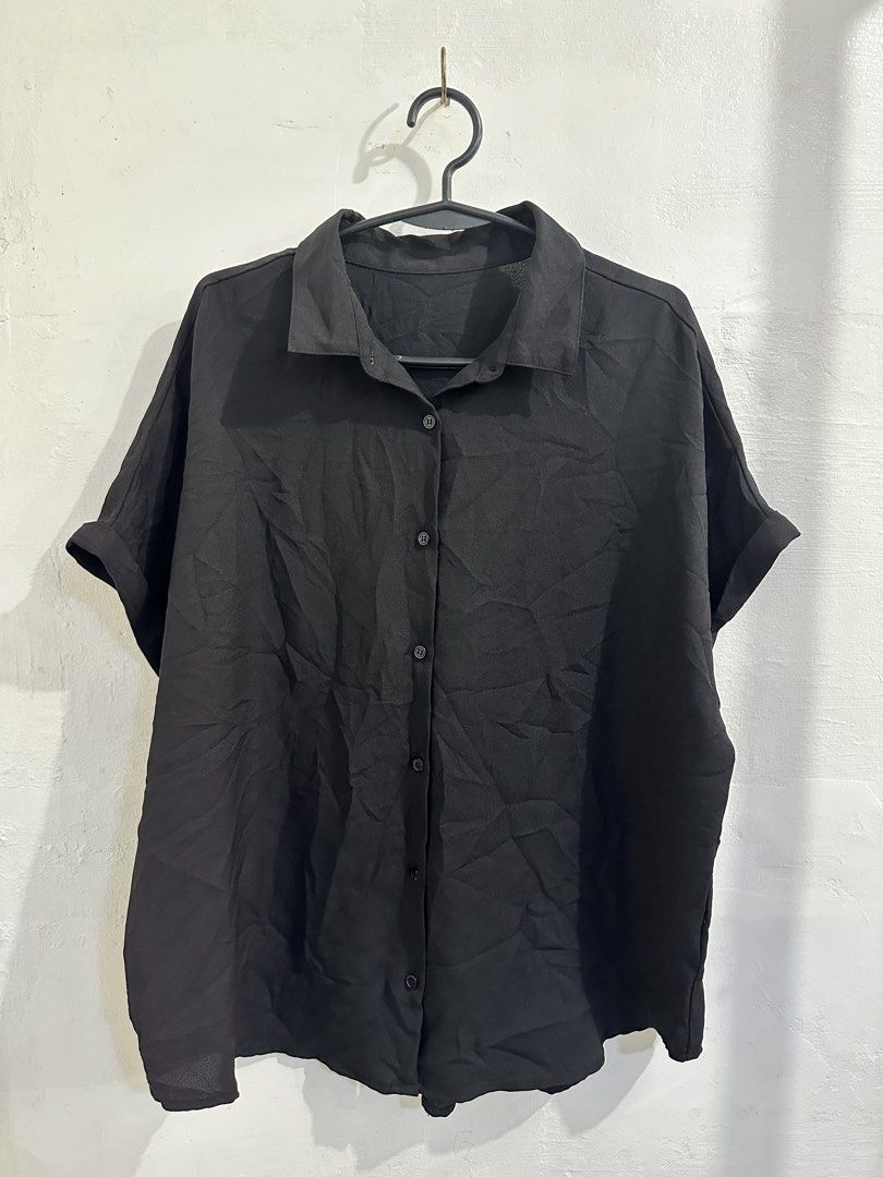 GU Black Oversized Short Sleeve Button Down Blouse Size XL (Category: Shirts) located in San Jose del Monte. Submitted by bizzybeebyhgc (Listing ID 1469437621, Image 1). Description: - Brand/Model: GU black button-down blouse - Size: XL (Relaxed, oversized fit) - Material: 100% lightweight polyester - Features: Short sleeves with rolled cuffs, collared neck, full front button placket, and back pleat detail - Style: Simple and versatile, perfect f