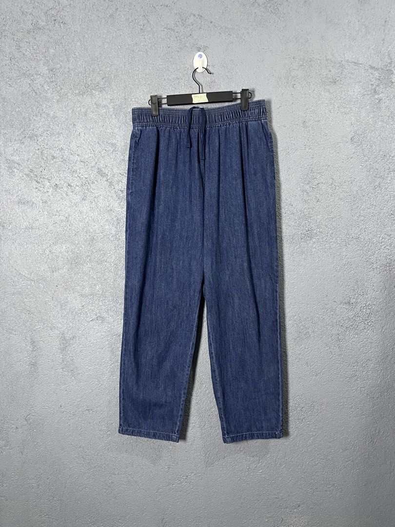 GU Blue Denim Jogger Pants Size L (Category: Jeans) located in Famy. Submitted by basicthrifted (Listing ID 1469405388, Image 1). Description: - Brand: GU - Style: Denim jogger pants - Color/Wash: Classic blue wash - Size: L (Tag attached) - Fit: Relaxed fit with clean hems - Material: 99% cotton blend - Features: Elastic waistband and matching drawstring closure.