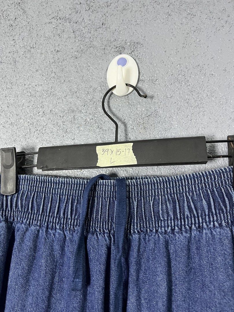 GU Blue Denim Jogger Pants Size L (Category: Jeans) located in Famy. Submitted by basicthrifted (Listing ID 1469405388, Image 3). Description: - Brand: GU - Style: Denim jogger pants - Color/Wash: Classic blue wash - Size: L (Tag attached) - Fit: Relaxed fit with clean hems - Material: 99% cotton blend - Features: Elastic waistband and matching drawstring closure.
