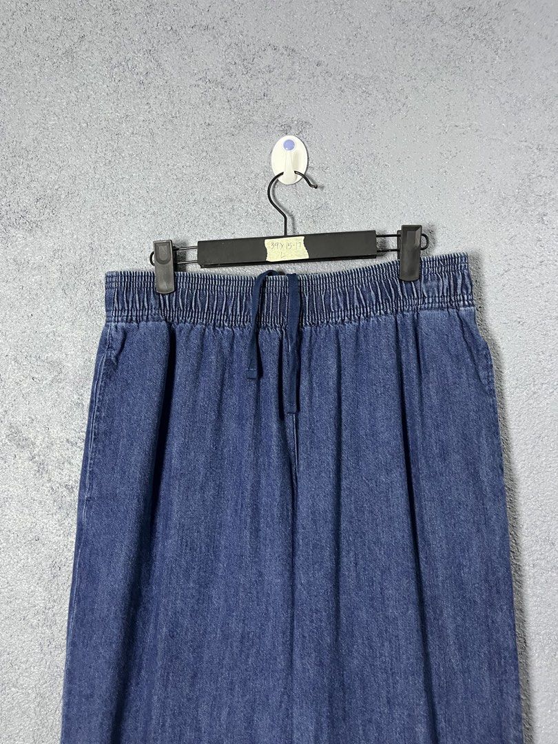 GU Blue Denim Jogger Pants Size L (Category: Jeans) located in Famy. Submitted by basicthrifted (Listing ID 1469405388, Image 2). Description: - Brand: GU - Style: Denim jogger pants - Color/Wash: Classic blue wash - Size: L (Tag attached) - Fit: Relaxed fit with clean hems - Material: 99% cotton blend - Features: Elastic waistband and matching drawstring closure.