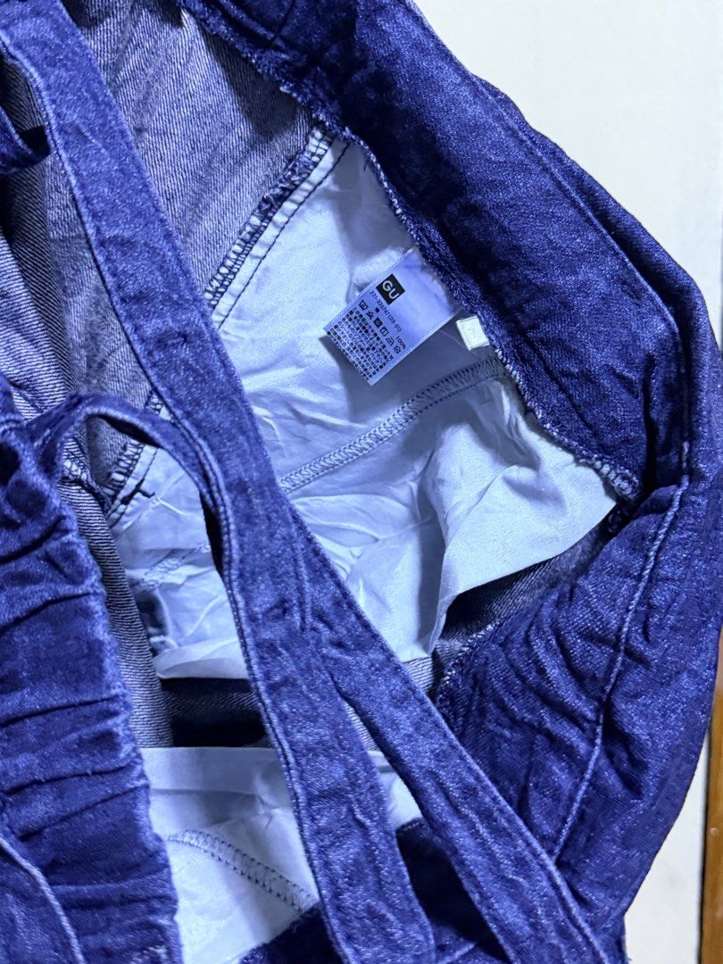GU Denim Blue Convertible Pants Overalls (Category: Jumpsuits) located in Paete. Submitted by skydruemadison (Listing ID 1469497511, Image 3). Description: - Brand: GU - Style: 2-in-1 convertible denim pants and overalls with removable shoulder straps - Wash: Deep blue wash - Fit: Wide leg fit with adjustable waist tie belt - Comfort: Elastic waistband at the back for a comfy fit - Versatility: Can be worn as regular high-waisted pants or as over