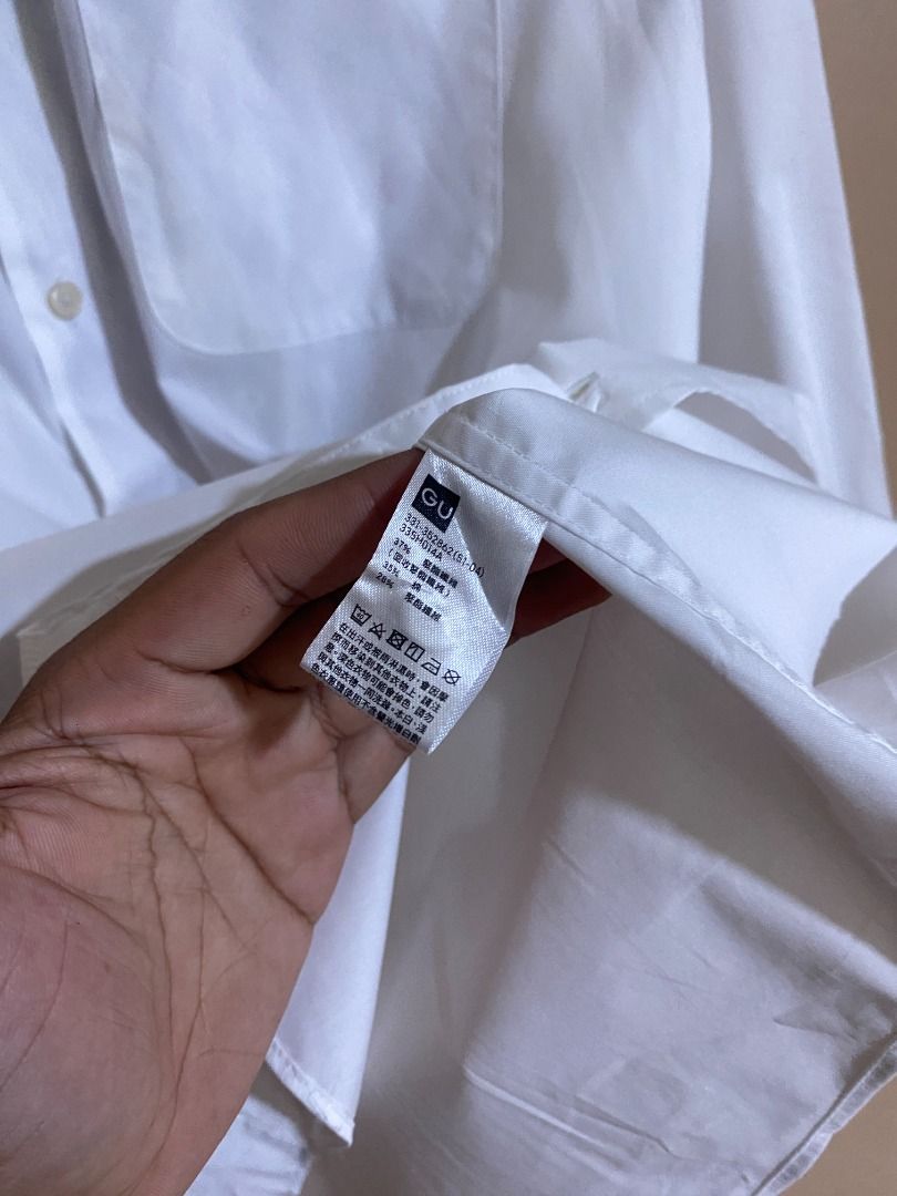 GU White Button Up Long Sleeves (Category: Tshirts & Polo Shirts ) located in Cadiz. Submitted by thespotcdz (Listing ID 1469535995, Image 3). Description: Large on tag Width 23" Length 30.5".