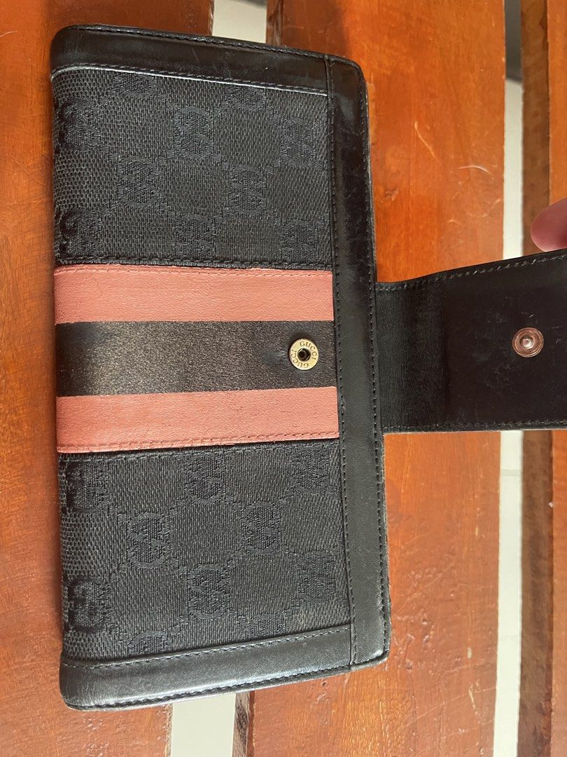 GUCCI (Category: Luxury Bags & Wallets) located in Quezon City. Submitted by glamshoppers101 (Listing ID 1469517094, Image 3). Description: Preloved In good used condition Leather are intact Snap is not working but wont affect the overall performance of the wallet No Inclusion Original.