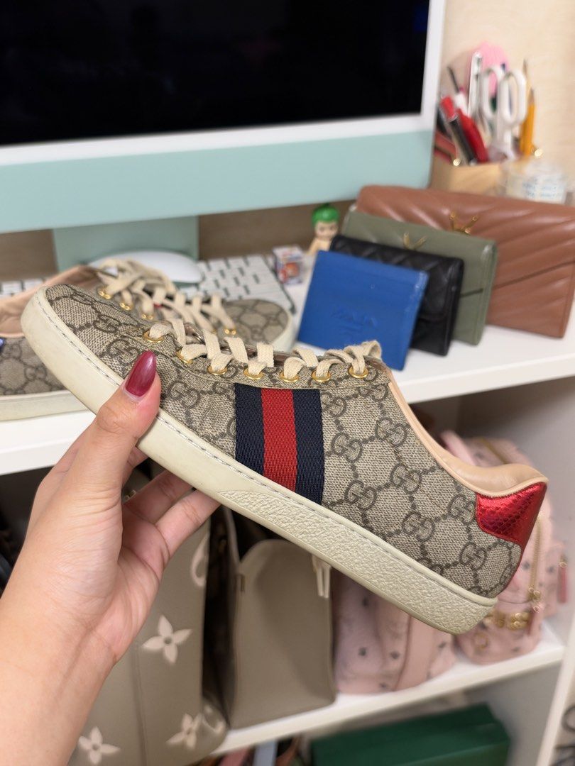 🏷️ gucci ace sneaker (9W) (Category: Sneakers) located in Pasay City. Submitted by erickaolalu (Listing ID 1469504476, Image 3). Description: •gg supreme canvas with signature red & blue web stripe • mismatched metallic snake-effect heels ❤️💙 •gold-tone eyelets & leather lining • good pre-loved condition • shoes only, no box or dustbag • delivery: grab express (from pasay).