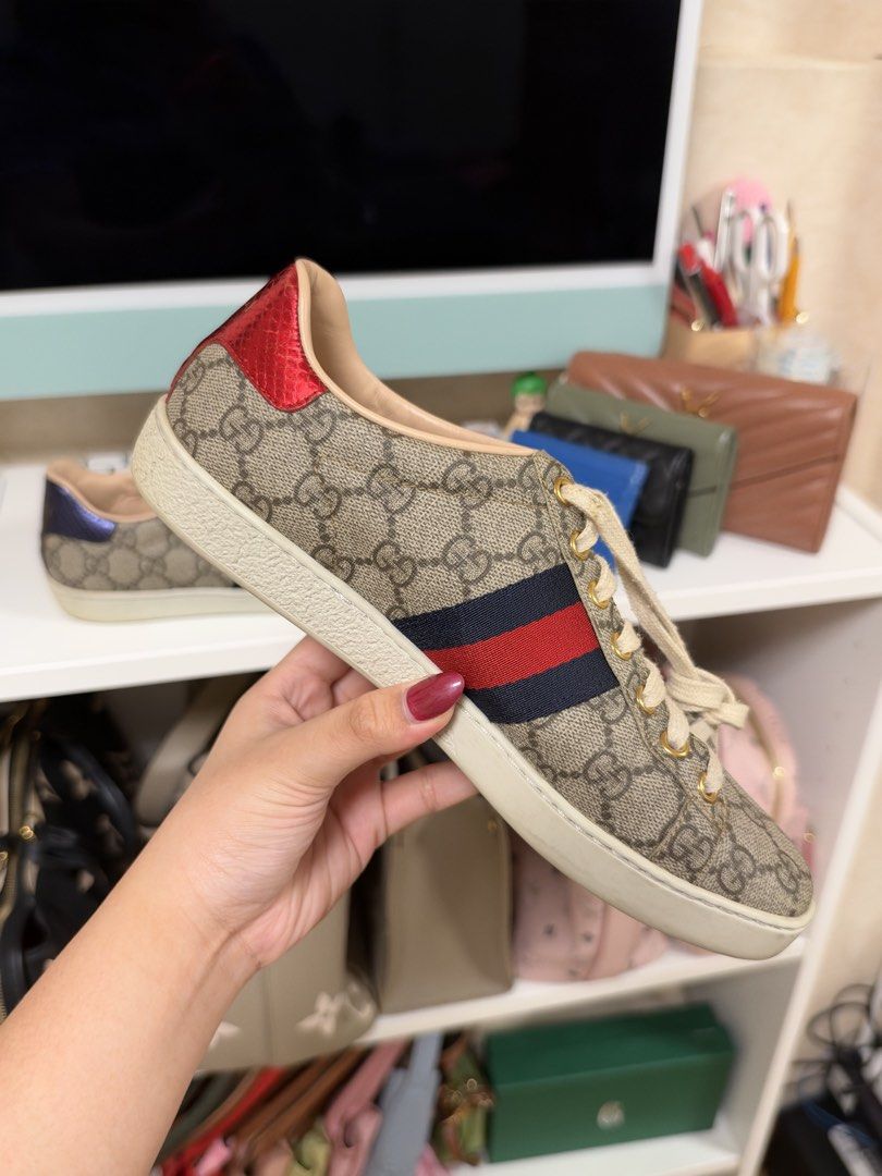 🏷️ gucci ace sneaker (9W) (Category: Sneakers) located in Pasay City. Submitted by erickaolalu (Listing ID 1469504476, Image 1). Description: •gg supreme canvas with signature red & blue web stripe • mismatched metallic snake-effect heels ❤️💙 •gold-tone eyelets & leather lining • good pre-loved condition • shoes only, no box or dustbag • delivery: grab express (from pasay).