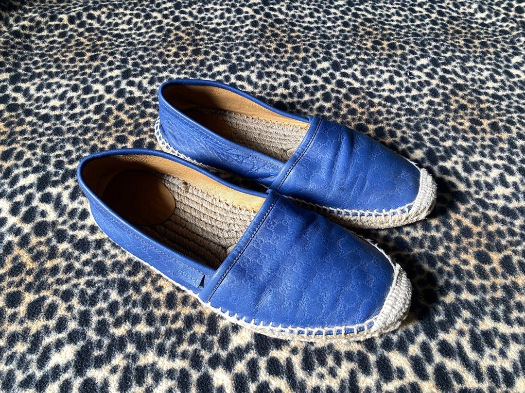Gucci Blue Leather GG Embossed Espadrilles (Category: Sneakers & Footwear) located in Cabuyao City. Submitted by heran_nn (Listing ID 1469411860, Image 2). Description: - Brand: Gucci -Size 39 - Style: Slip-on espadrilles - Color: Royal blue - Material: Premium leather with all-over embossed GG monogram - Sole: Traditional jute braided sole with stitched trim - Details: Small embossed Gucci side tag, interior heel stamped with serial number 56719