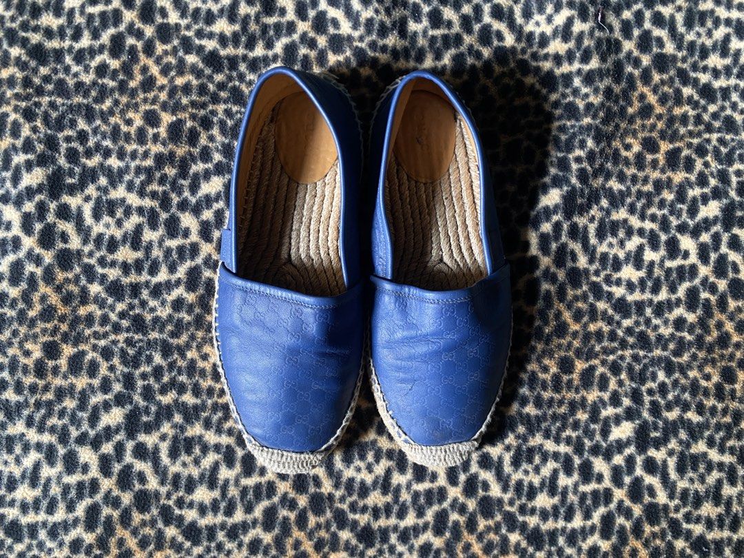 Gucci Blue Leather GG Embossed Espadrilles (Category: Sneakers & Footwear) located in Cabuyao City. Submitted by heran_nn (Listing ID 1469411860, Image 1). Description: - Brand: Gucci -Size 39 - Style: Slip-on espadrilles - Color: Royal blue - Material: Premium leather with all-over embossed GG monogram - Sole: Traditional jute braided sole with stitched trim - Details: Small embossed Gucci side tag, interior heel stamped with serial number 56719