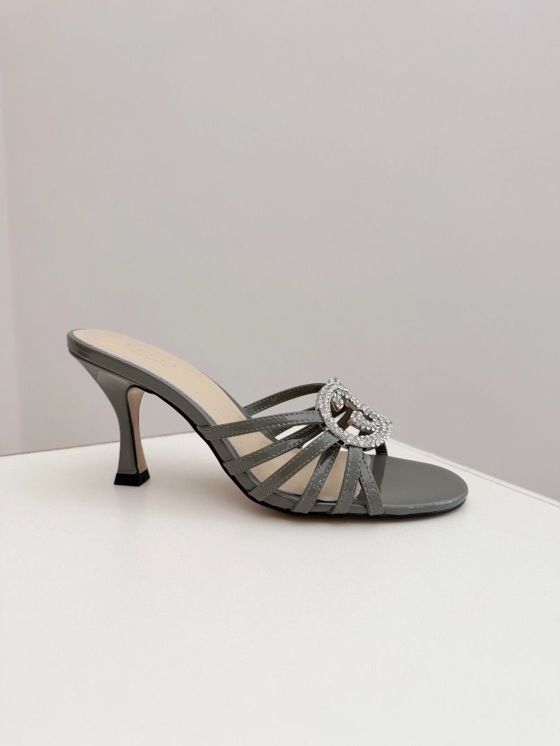 Gucci Crystal Interlocking G Mules Heels Grey(High-end custom model） (Category: Heels) located in Pasay City. Submitted by thesky-- (Listing ID 1469469709, Image 3). Description: - Brand: Gucci - Style: High heel mules with strappy front and stiletto heels - Material: Grey patent leather - Detail: Rhinestone-encrusted interlocking G logo - Inclusions: Original box and dust bag included - Note: Other colors available, feel free to ask!.