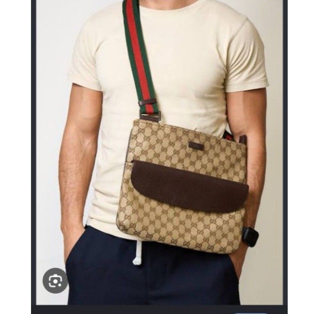 Gucci GG Canvas Messenger Bag with Web Strap UNISEX (Category: Luxury Bags & Wallets) located in Santa Rosa. Submitted by laria.maria (Listing ID 1469428849, Image 2). Description: - Authentic Gucci messenger bag in classic GG monogram canvas - Features a stylish brown leather front pocket - Signature green and red web stripe adjustable canvas shoulder strap - Spacious interior compartment, perfect for daily essentials - Clean interior lining wit
