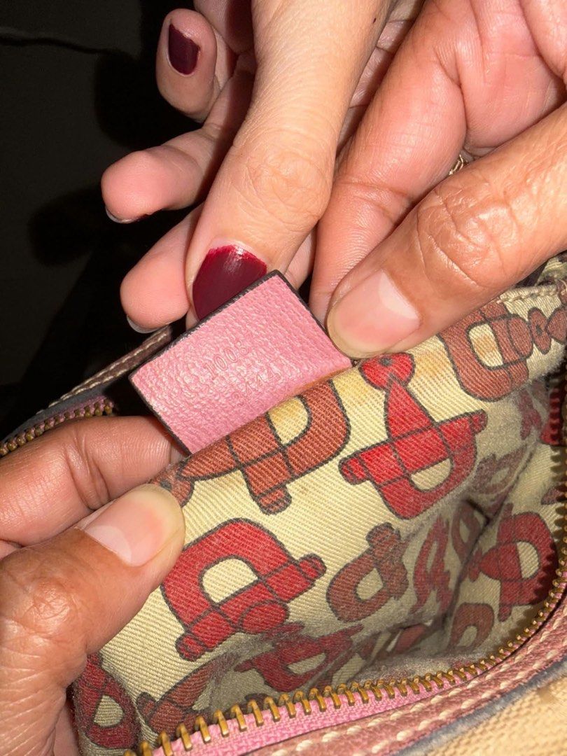Gucci GG Canvas Mini Handbag Pink Beige (Category: Luxury Bags & Wallets) located in Cainta. Submitted by riszizlux (Listing ID 1469543565, Image 2). Description: - Authentic Gucci mini handbag - Classic beige GG canvas with chic pink leather trim - Secure top zip closure and double top handles - Red and beige patterned fabric interior with leather brand tag and serial number - Compact size perfect for daily essentials - Condition: Minor wear on 