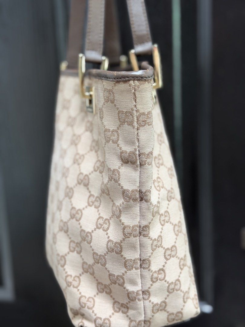 Gucci GG Canvas Mini Tote Bag (Category: Luxury Bags & Wallets) located in Marikina City. Submitted by periwinklestore88 (Listing ID 1469354522, Image 3). Description: - Authentic Gucci GG canvas tote bag in classic brown - Premium leather trim and sturdy dual straps - Elegant gold-tone hardware with engraved Gucci lettering - Clean dark fabric interior with a secure zipped pocket - Features the official 'Gucci made in Italy' leather stamp - Spac