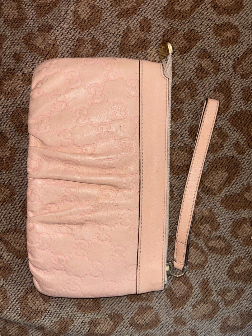 Gucci Pink Guccissima Leather D-Ring Wristlet (Category: Luxury Bags & Wallets) located in Legazpi City. Submitted by hrshy.cln (Listing ID 1469409470, Image 2). Description: - 100% Authentic Gucci wristlet in pink Guccissima debossed leather - Features a chic structured D-ring accent and embossed Gucci lettering - Secure zip-top closure with a signature gold-toned Gucci logo zipper pull - Convenient side wrist strap for easy, hands-free carrying