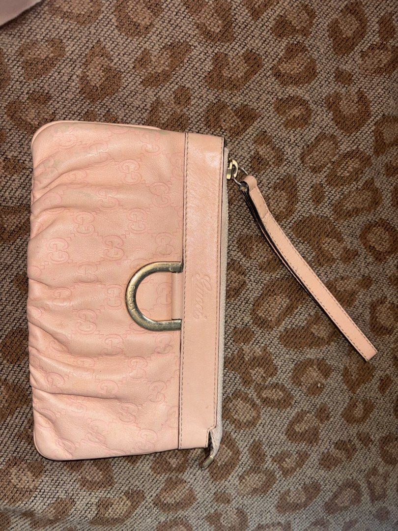 Gucci Pink Guccissima Leather D-Ring Wristlet (Category: Luxury Bags & Wallets) located in Legazpi City. Submitted by hrshy.cln (Listing ID 1469409470, Image 1). Description: - 100% Authentic Gucci wristlet in pink Guccissima debossed leather - Features a chic structured D-ring accent and embossed Gucci lettering - Secure zip-top closure with a signature gold-toned Gucci logo zipper pull - Convenient side wrist strap for easy, hands-free carrying