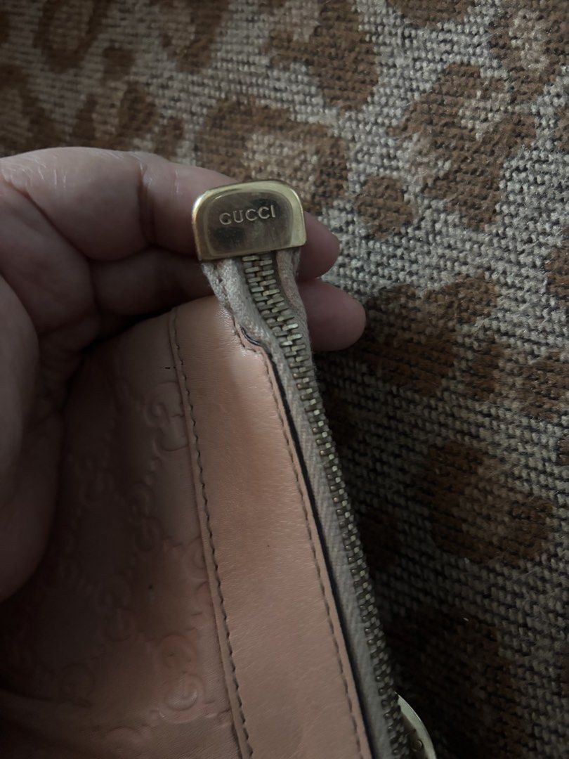 Gucci Pink Guccissima Leather D-Ring Wristlet (Category: Luxury Bags & Wallets) located in Legazpi City. Submitted by hrshy.cln (Listing ID 1469409470, Image 3). Description: - 100% Authentic Gucci wristlet in pink Guccissima debossed leather - Features a chic structured D-ring accent and embossed Gucci lettering - Secure zip-top closure with a signature gold-toned Gucci logo zipper pull - Convenient side wrist strap for easy, hands-free carrying