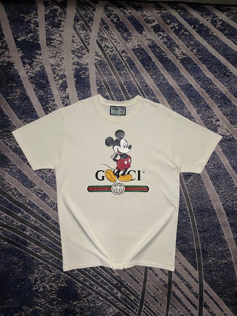 Gucci x Mickey Mouse Shirt ( authentic ) (Category: Luxury Apparel) located in Goa. Submitted by _rawgallery (Listing ID 1469516545, Image 1). Description: needs wash with minimal yellow stain not noticeable‼️ size on tag : m width : 22.5 length : 30.5.