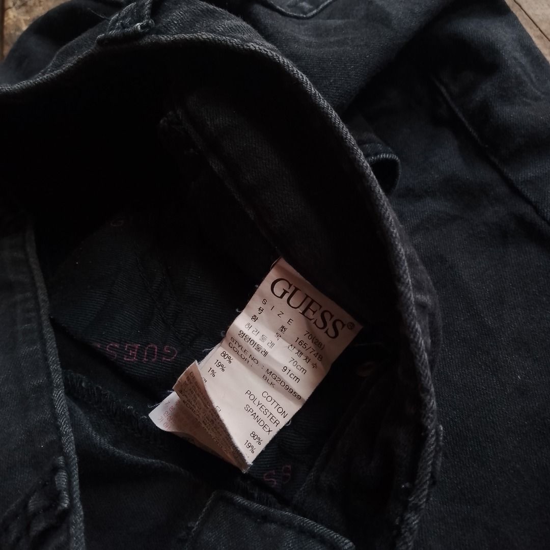 Guess Black Denim Shorts Size 26 (Category: Shorts) located in Caloocan City. Submitted by alfepangasate1021 (Listing ID 1469439426, Image 3). Description: - Brand: Guess - Color: Washed black - Size: 70 (approx. US 26) - Fit: Mid-rise with standard button and zip closure - Style: Classic 5-pocket setup with iconic Guess triangle logo on the back pocket - Details: Branded leather patch on rear waistband - Material: 80% cotton, 19% polyester, 1% s