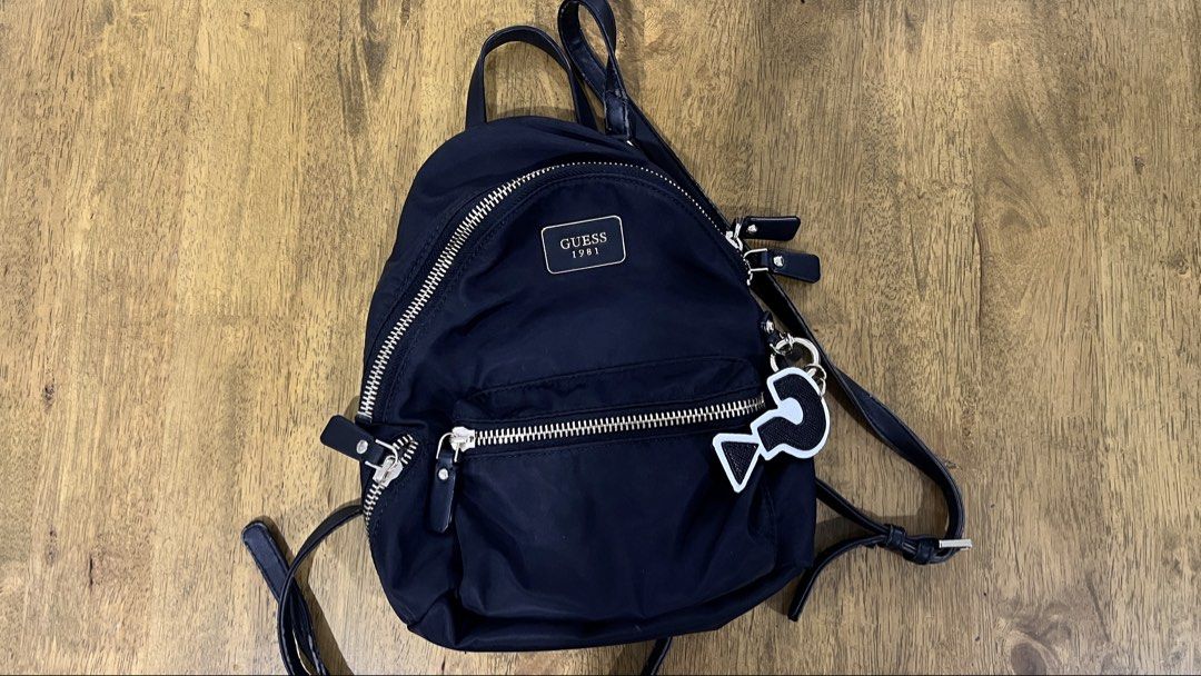 Guess Black Small Backpack (Category: Backpacks) located in San Fernando. Submitted by declutteringyishi (Listing ID 1469491269, Image 1). Description: There is some visible peeling on the straps due to regular use, but overall, the item is still in good condition. .