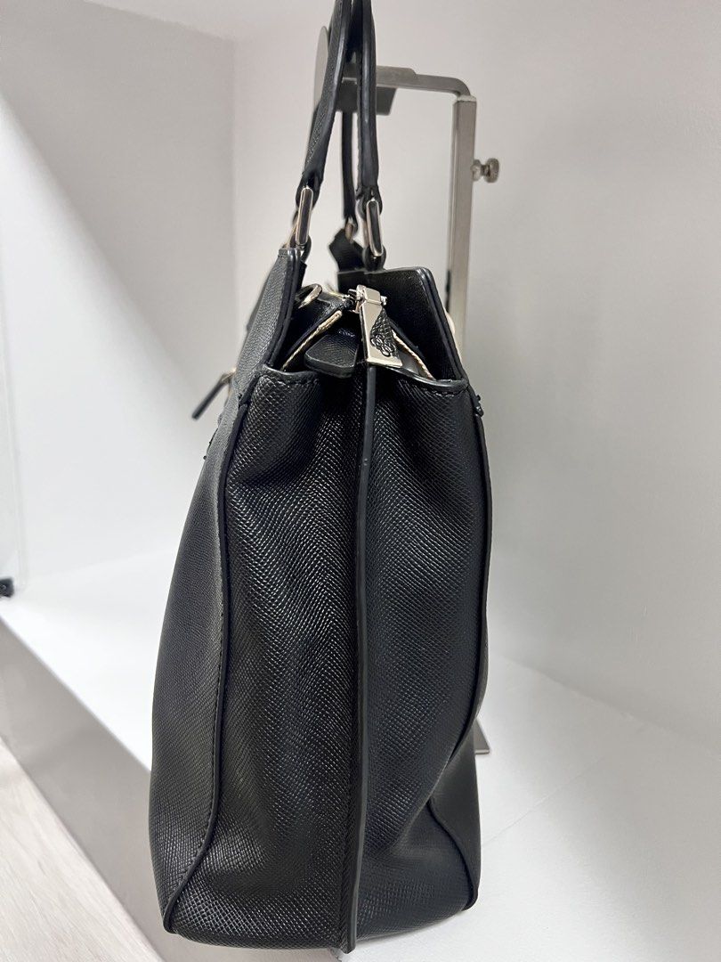 Guess Black Structured Handbag Saffiano Leather (Category: Luxury Bags & Wallets) located in San Jose del Monte. Submitted by itstokyotokyo (Listing ID 1469394279, Image 3). Description: Zalora Bought / As Is Where Is✨ / 9/10 - Brand: Guess - Color: Black with silver hardware - Material: Durable Saffiano textured material - Closure: Zippered main compartment - Pockets: External back zip pocket and interior organizational pockets - Handles: Dual t
