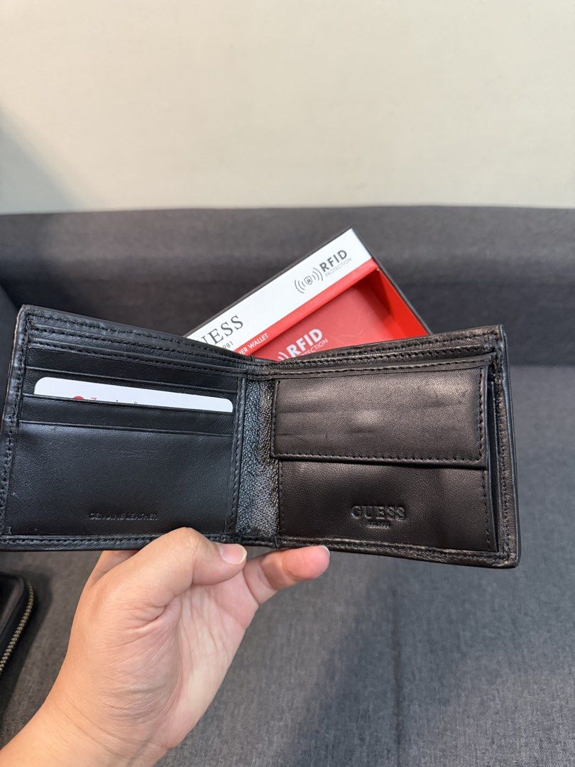 Guess Genuine Leather RFID Protection Wallet (Category: Wallets & Card Holders) located in Quezon City. Submitted by pam07pam (Listing ID 1469481764, Image 3). Description: - 100% Authentic Guess bifold wallet in classic black monogram - Crafted from premium genuine leather for durability - Built-in RFID protection keeps your cards safe from digital theft - Features multiple card slots, spacious cash compartments, and a convenient flip-out ID/car