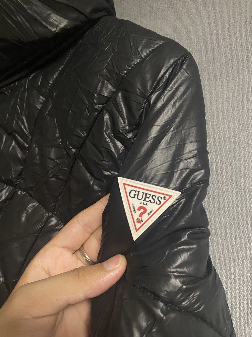 Guess Puffer Jacket (Category: Coats, Jackets and Outerwear) located in Cabuyao City. Submitted by ukaythriftshirt (Listing ID 1469419751, Image 2). Description: Guess Puffer Jacket Excellent Condition Medium Dimes 18-24 Color rate 9/10 No issue - 1000.