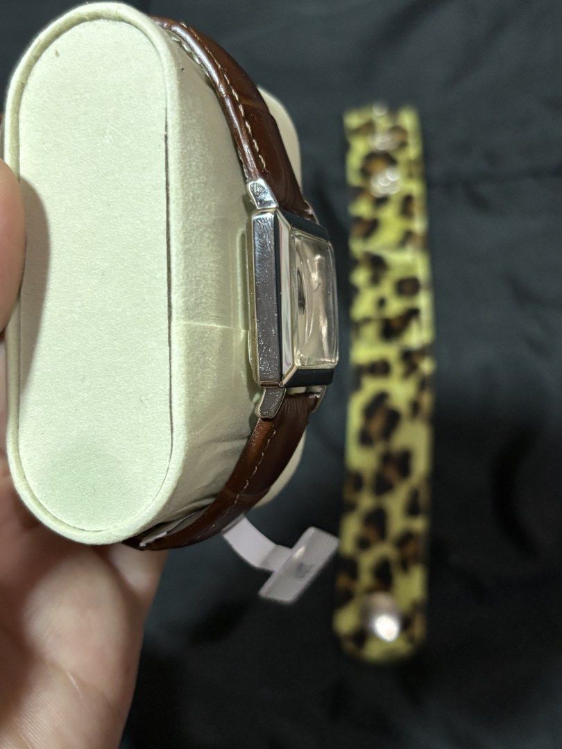 Guess Square Dial Watch with Brown Leather Strap (Category: Women's Watches) located in Caloocan City. Submitted by berndale_closet (Listing ID 1469570620, Image 3). Description: - Brand: Guess - Dial: Square dial with a sleek silver face - Strap 1: Brown genuine leather with white stitching - Strap 2: Bonus yellow leopard print accessory strap - Movement: Reliable Japan movement - Condition: Brand new with tag attached - Details: Original Guess 