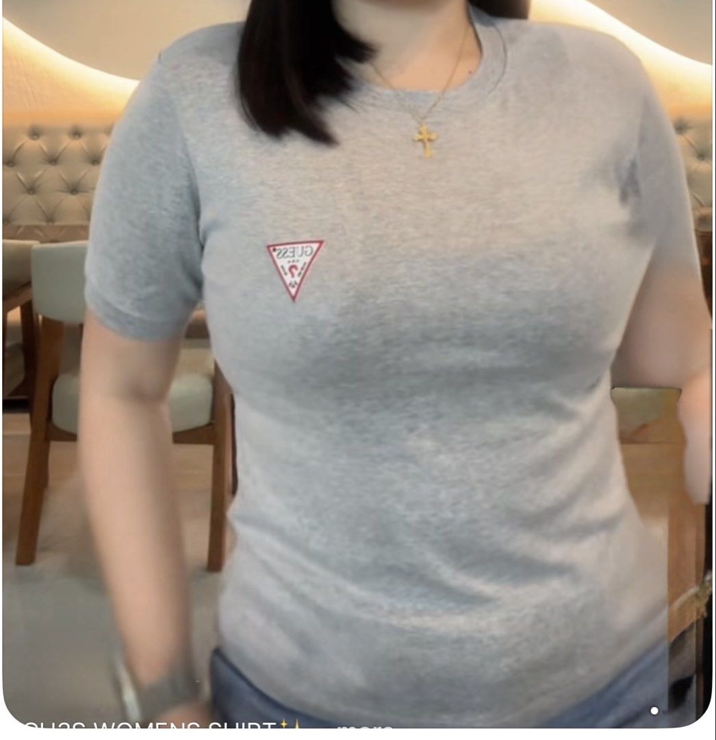 GUESS Women's Triangle Logo Tee Size L (Category: Shirts) located in Angeles City. Submitted by thon-thal (Listing ID 1469434808, Image 2). Description: - Brand: Guess - Style: Crewneck tee with embroidered red triangle logo - Fit & Material: Regular fit, 100% cotton - Size: Large - Colors Available: Heather grey, dusty pink, sage green, and dark navy - Condition: Brand new, still in original plastic packaging with swing tags attached -green and 