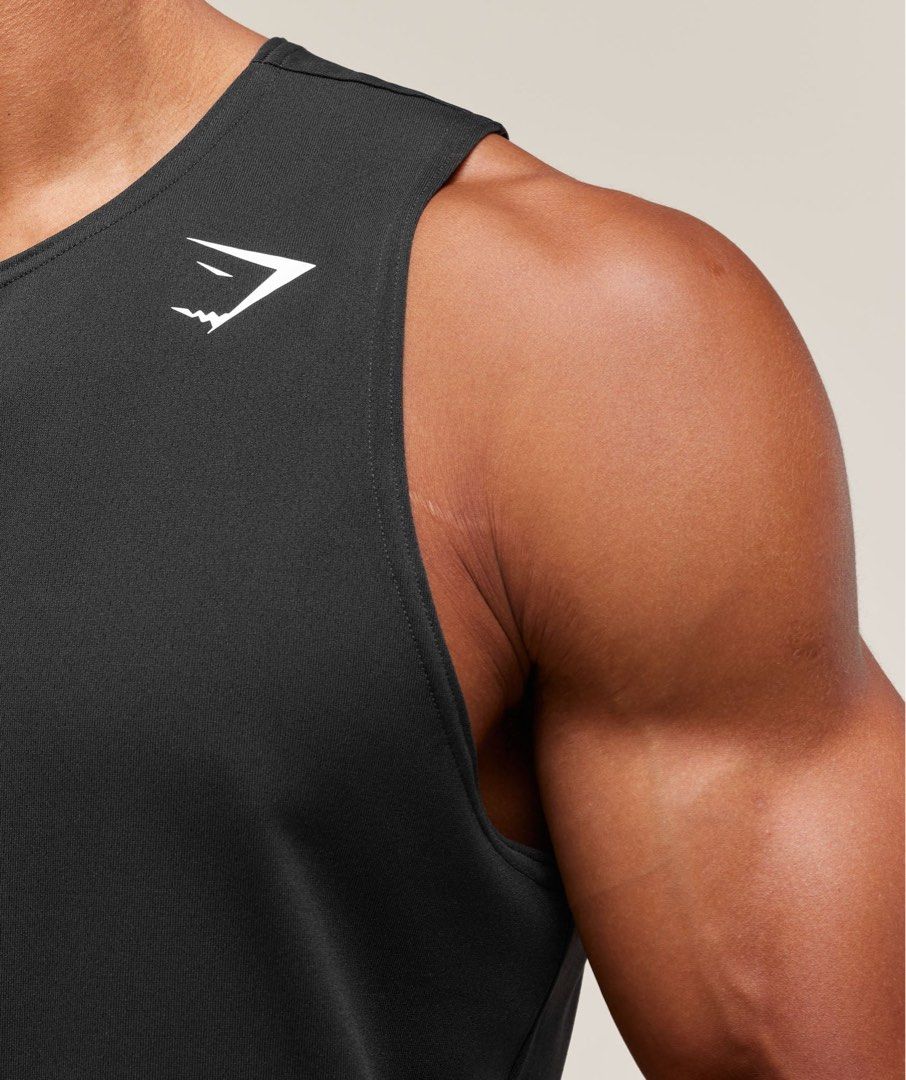 Gymshark Arrival Tank Black (Category: Activewear) located in Pasig City. Submitted by prelovedbychl (Listing ID 1469503613, Image 3). Description: - 100% authentic! - size: small (model is wearing medium) - got it for Php 1,600 + US shipping - good as new, sinukat lang.