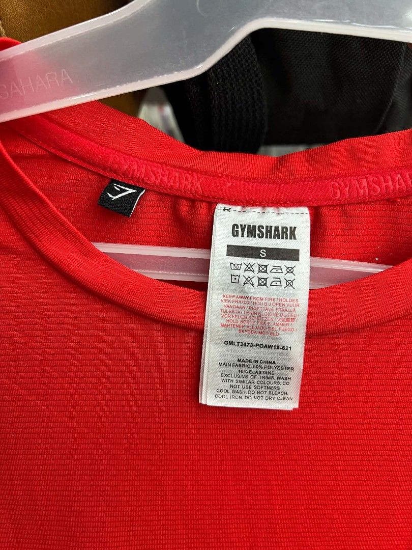 Gymshark Red Long Sleeve Workout Top (Category: Longsleeves) located in Urdaneta. Submitted by jayceegarage (Listing ID 1469543408, Image 3). Description: - Brand: Gymshark - Color: Red - Size: Small - Material: 90% Polyester, 10% Elastane - Features: Breathable micro-perforated fabric, white logo on chest, crew neck with inner branding - Condition: Great activewear piece for workouts and training.