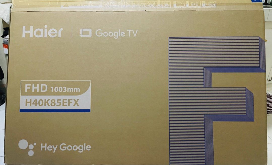 Haier H40K85EFX Google TV (Category: TV) located in Paranaque City. Submitted by ellebuj27 (Listing ID 1469458716, Image 2). Description: - Brand: Haier 40-inch FHD Google TV (Model: H40K85EFX) - Condition: Like new, box unsealed only for setup testing - Features: Built-in Smart TV functionality with Hey Google integration for easy voice control - Inclusions: Original silver remote control and original packaging box - Perfect for bedrooms, living