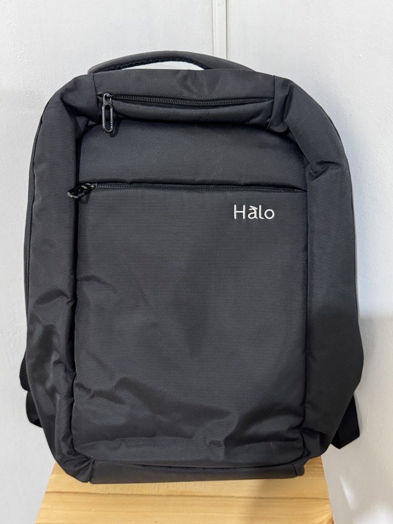 Halo Black Backpack Laptop Bag (Category: Backpacks) located in Paranaque City. Submitted by shopdecalidad (Listing ID 1469438756, Image 1). Description: - Color: Classic Black - Exterior: Convenient front zip pockets - Interior: Main compartment with inner slip pockets, mesh pouch, and key strap hook - Comfort: Breathable mesh padding on back panel and shoulder straps - Perfect for daily use, school, or work.