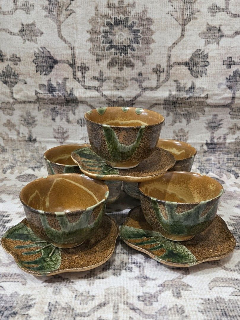 Handleless ceramic cup and saucer set (5 pairs) (Category: Coffee & Tea Tableware) located in Manila. Submitted by cwknds (Listing ID 1469496369, Image 1). Description: complete set of 5 handleless ceramic cups with matching flower-lobed saucers. crafted with an expressive amber-brown glaze, speckled texturing, and deep forest green accents. • cup 6 x 8 cm • saucer 11.7cm • brandnew set of 5 w/ box • ₱399/pair ~ personally sourced&curated.