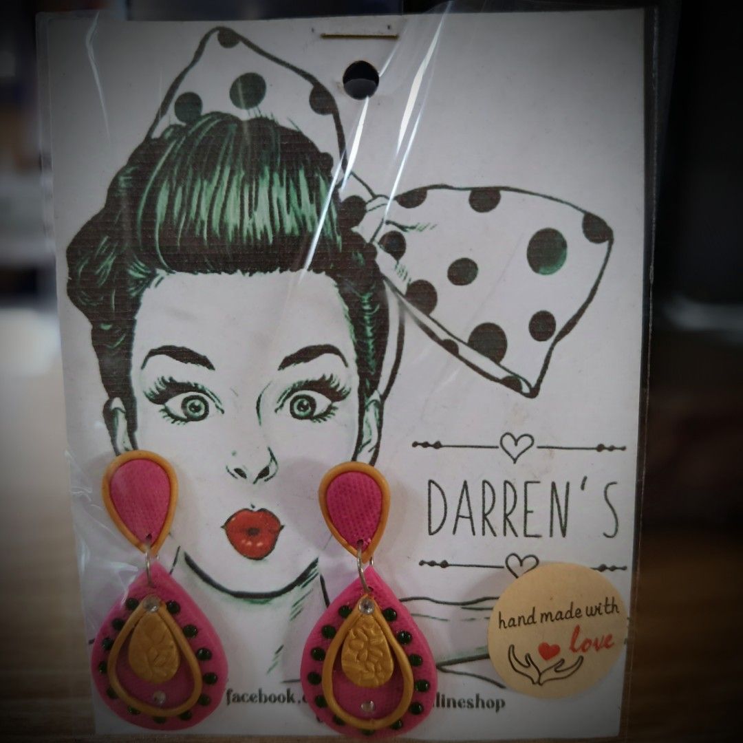 HANDMADE POLYMER CLAY DANGLING EARRINGS (Category: Earrings) located in San Pedro. Submitted by abieboink (Listing ID 1469440841, Image 2). Description: - Brand: Darren's - Product: Handmade polymer clay dangling earrings - Design: Blue and black teardrop pattern with intricate bead details - Condition: Brand new, packaged with backing card - Features: Lightweight, unique artisan style .
