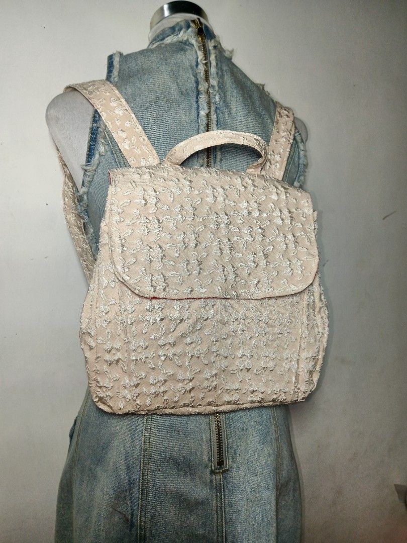 Handmade Textured Floral Print Mini Backpack Cream Off-White (Category: Backpacks) located in Manila. Submitted by danisadall (Listing ID 1469473809, Image 1). Description: - Color: Textured off-white with all-over tiny floral embroidery - Closure: Flap top - Size: Neat daily size, perfect for keys, phone, and small essentials - Material: Lightweight fabric construction.