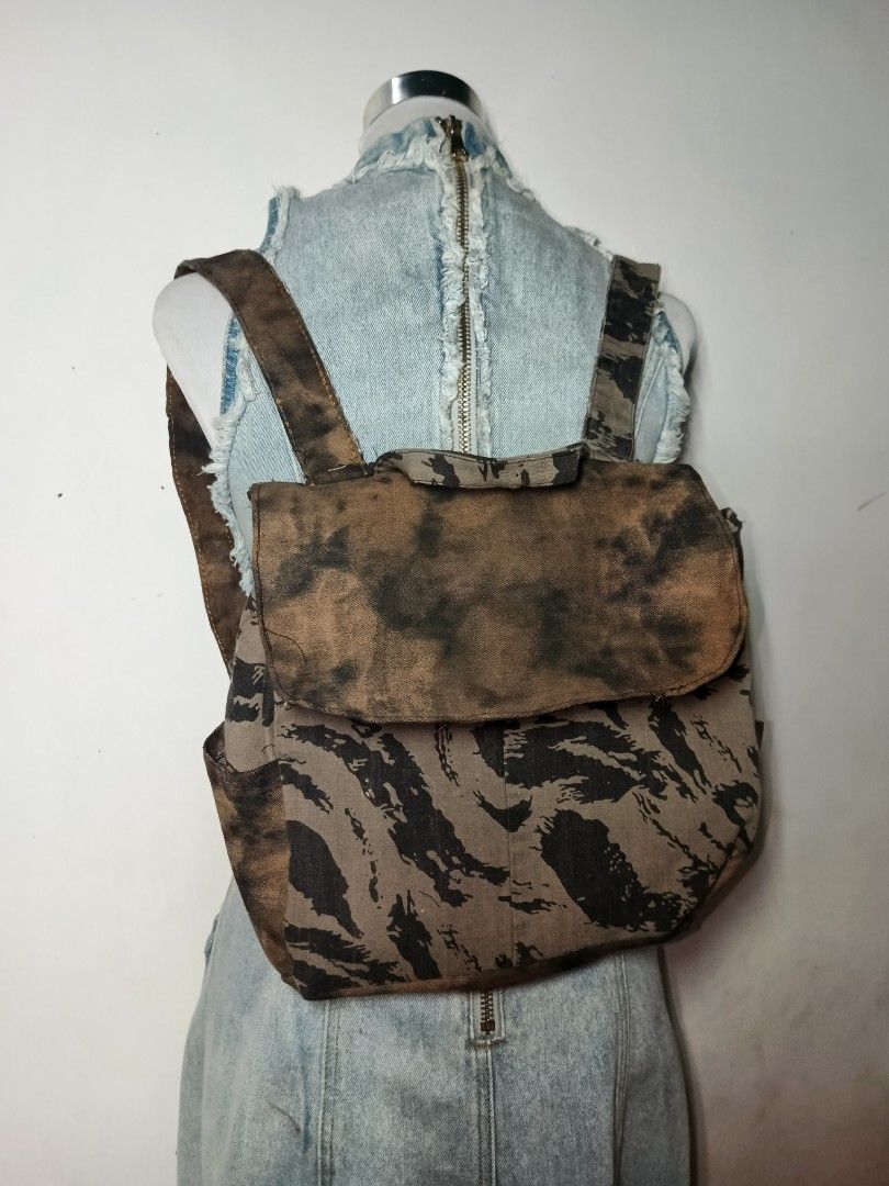 Handmade Vintage Camo Print Canvas Backpack (Category: Backpacks) located in Manila. Submitted by danisadall (Listing ID 1469473551, Image 1). Description: - Brown and black camo print canvas - Flap closure with secure back straps - Roomy main compartment for daily essentials - Cool and rugged style.