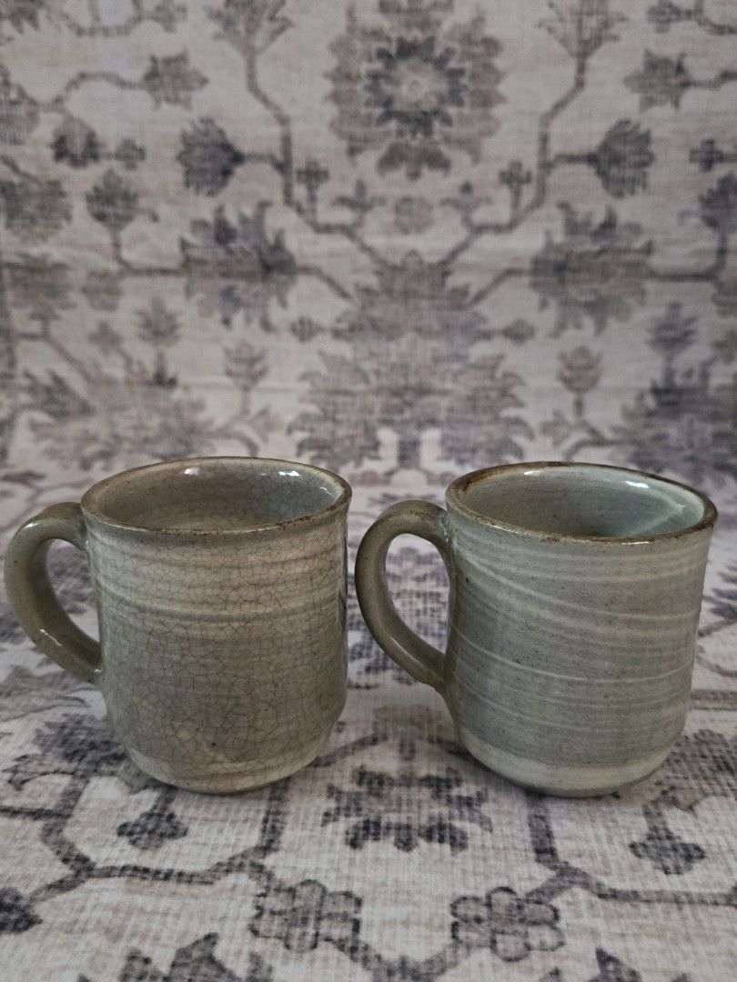 Handpainted ceramic cups bundle set (2pcs) (Category: Coffee & Tea Tableware) located in Manila. Submitted by cwknds (Listing ID 1469485850, Image 3). Description: pair of handthrown cups. detailed with fluid, handpainted fish artwork across an unrefined cream and sage stoneware body. • 7.5 x 6.5 cm • potter's mark ~ personally sourced&curated.
