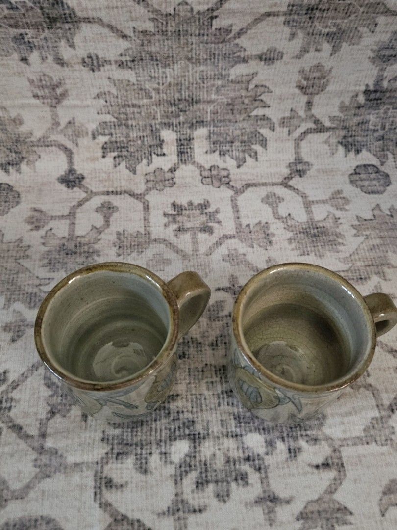 Handpainted ceramic cups bundle set (2pcs) (Category: Coffee & Tea Tableware) located in Manila. Submitted by cwknds (Listing ID 1469485850, Image 2). Description: pair of handthrown cups. detailed with fluid, handpainted fish artwork across an unrefined cream and sage stoneware body. • 7.5 x 6.5 cm • potter's mark ~ personally sourced&curated.