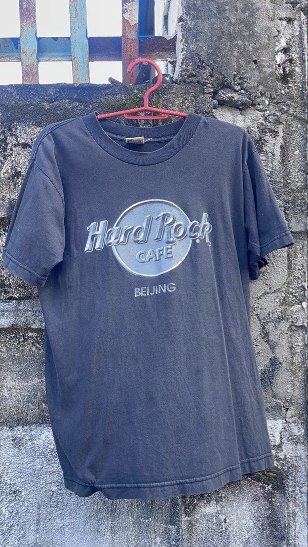 Hard Rock Cafe Beijing T-shirt Black (Category: Tshirts & Polo Shirts ) located in Balanga. Submitted by death_vintage (Listing ID 1469476648, Image 1). Description: - Brand: Hard Rock Cafe Beijing - Color: Washed black with vintage cracked front graphic - Size: Small (100% cotton, made in China) - Fit: Short sleeves, crew neck - Condition: Great pre-loved wear - Care: Cold machine wash.