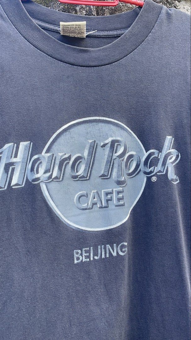 Hard Rock Cafe Beijing T-shirt Black (Category: Tshirts & Polo Shirts ) located in Balanga. Submitted by death_vintage (Listing ID 1469476648, Image 2). Description: - Brand: Hard Rock Cafe Beijing - Color: Washed black with vintage cracked front graphic - Size: Small (100% cotton, made in China) - Fit: Short sleeves, crew neck - Condition: Great pre-loved wear - Care: Cold machine wash.