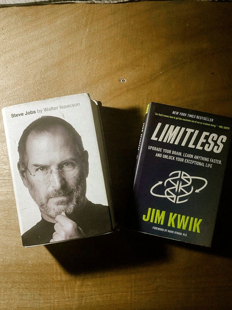 Hardcover Self-Help & Tech Biography Book Bundle (Steve Jobs & Limitless) (Category: Storybooks) located in Davao. Submitted by theblacklady96 (Listing ID 1469568003, Image 1). Description: • Covers: Outer dust jackets show visible cosmetic wear, including yellowing, edge crinkles, handling dimples, and a small corner tear on Limitless. • Inside Pages: Excellent reading condition! Both books feature completely clean, crisp inside pages with absol