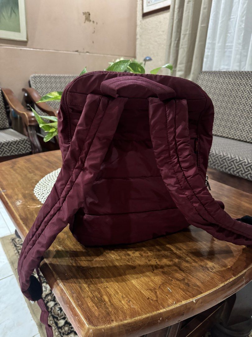 Hedgren Maroon Nylon Backpack (Category: Backpacks) located in Danao, Cebu. Submitted by jojie.1983 (Listing ID 1469417695, Image 2). Description: - Brand: Hedgren -Size: Medium - Color: Maroon - Material: Durable nylon with silver hardware - Storage: Multiple zippered compartments on the front for easy organization - Comfort: Padded shoulder straps and top grab handle - Condition: Clean exterior fabric with minor everyday wear.