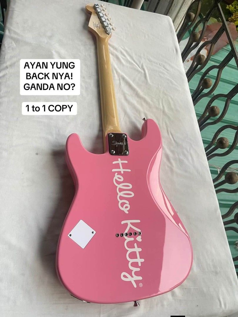 Hello Kitty Squier Version 1 Electric Guitar (Category: Musical Instruments) located in General Santos City (Dadiangas). Submitted by jay_roa (Listing ID 1469516322, Image 2). Description: - Model: Kitty Squier Electric Guitar (Version 1) - Color: Pink body with iconic white pickguard graphic - Specs: Maple neck, single humbucker pickup, single volume knob - Condition: Fully setup and ready to play right out of the box - Perks: Free nationwide sh