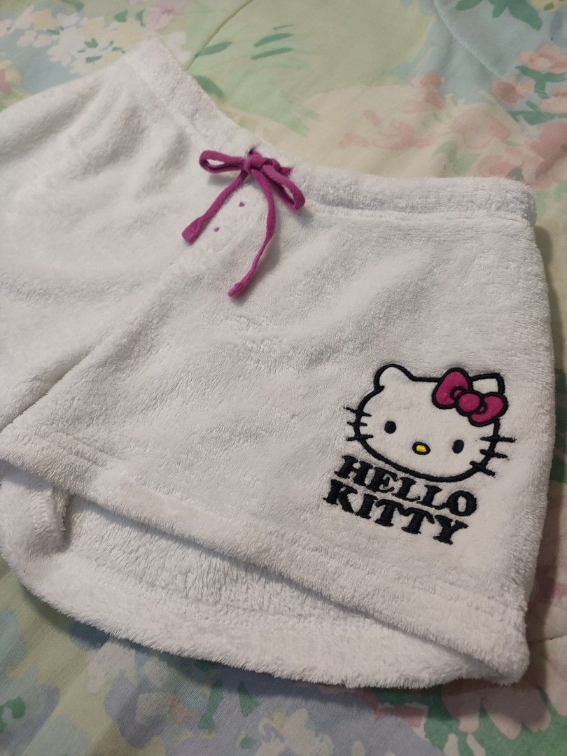 Hello Kitty White Towel Shorts Size L (Category: Shorts) located in Jaen. Submitted by roxantiago (Listing ID 1469482388, Image 3). Description: - Super soft and cozy white fuzzy shorts - Towel-like plush fabric for ultimate comfort - Adjustable pink drawstring waist with bow detail - Cute embroidered Kitty face and logo on the leg - Size: L - Condition: Clean and ready to wear.