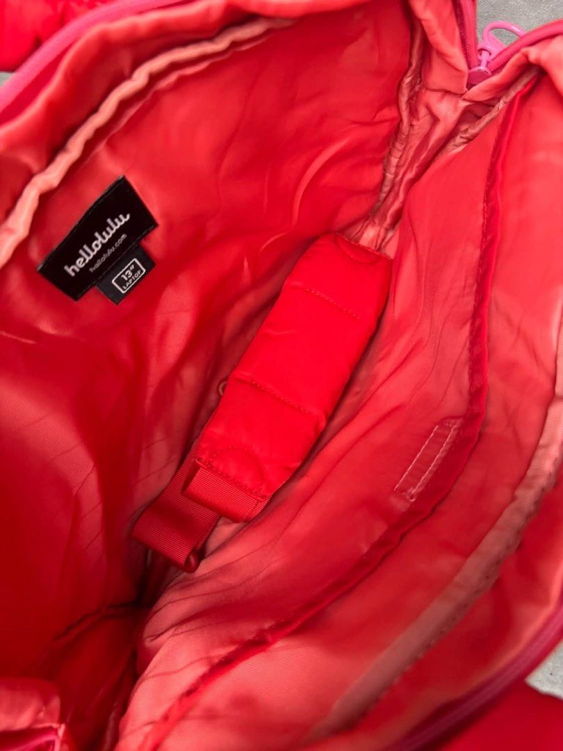 Hellolulu Red 13 inch Laptop Bag (Category: Laptop Bags & Sleeves) located in Baguio. Submitted by gokubusansan (Listing ID 1469560139, Image 3). Description: - Brand: Hellolulu - Color: Bright red - Fit: Comfortably fits up to a 13-inch laptop - Compartments: Padded inner compartment for laptop safety - Pockets: Zippered front pocket and interior pockets for chargers and mice - Handles: Convenient dual carry handles on top - There’s dirt on the 