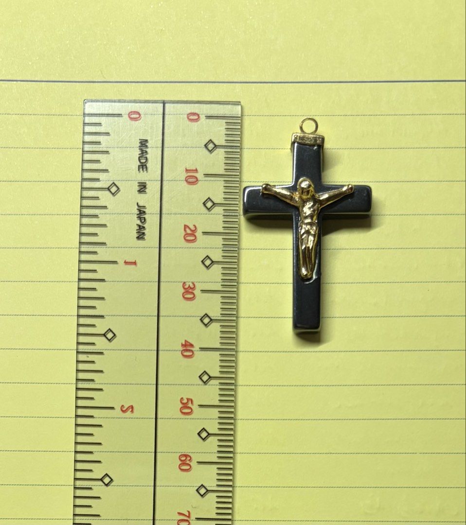 Hematite and Gold Tone Crucifix Pendant (Category: Necklaces) located in Quezon City. Submitted by garagesale2026 (Listing ID 1469554577, Image 2). Description: - Material: Dark grey hematite with gold-tone corpus and top loop - Size: Roughly 5 cm in total height (including the bail).