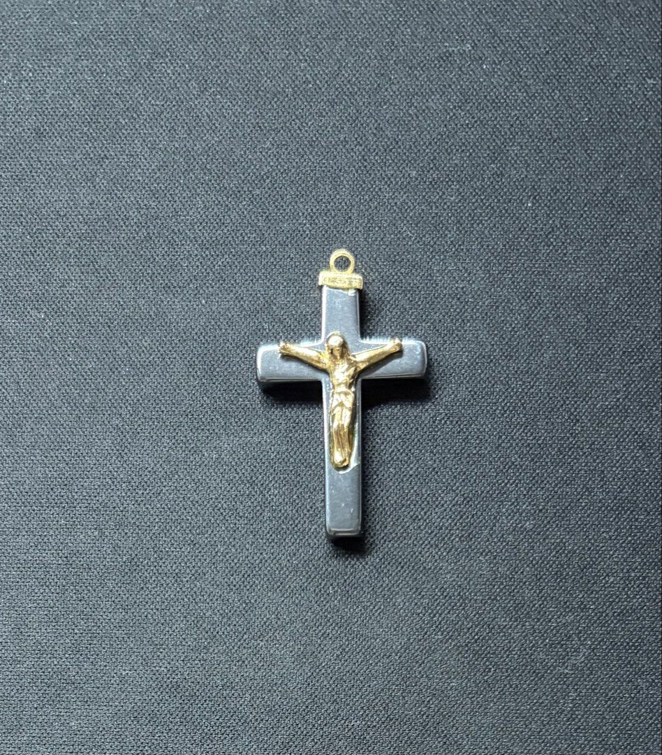 Hematite and Gold Tone Crucifix Pendant (Category: Necklaces) located in Quezon City. Submitted by garagesale2026 (Listing ID 1469554577, Image 1). Description: - Material: Dark grey hematite with gold-tone corpus and top loop - Size: Roughly 5 cm in total height (including the bail).