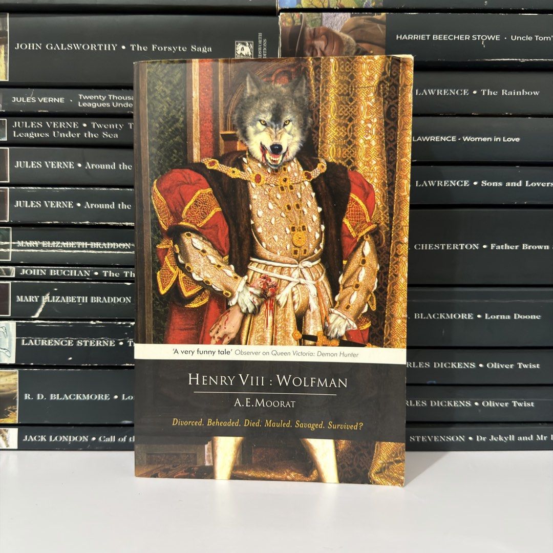 Henry VIII : Wolfman by A.E. Moorat (Category: Storybooks) located in Lingayen. Submitted by readwjane (Listing ID 1469482298, Image 1). Description: - Title: Henry VIII: Wolfman by A.E. Moorat - Publisher: The Folio Society - Cover: Features a unique portrait of a wolf-headed king with the tagline 'Divorced. Beheaded. Died. Mauled. Savaged. Survived?' - Condition: Great overall, clean pages, and solid binding - Genre: Fun historical fiction and 