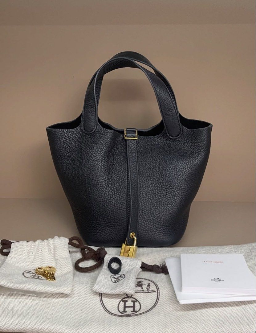 Hermes Picotin 18 Caban (Category: Luxury Bags & Wallets) located in Makati City. Submitted by dgcurated09 (Listing ID 1469568271, Image 1). Description: - Brand: Hermès Stamp U - Model: Picotin Lock - Color: Classic Black - Material: Premium grainy leather - Hardware: Gold - Style: Bucket bag with top handles - Inclusions: Padlock, two keys in small dust bags, care booklet, and large dust bag - Condition: Excellent / Well-maintained.